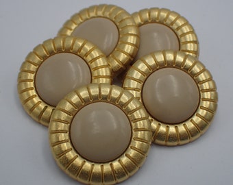 five vintage bronze buttons with beige center