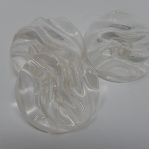 Three transparent buttons, wave effect, plastic material, diameter 2.2 cm
