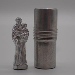 old miniature statue Saint Christopher with his case