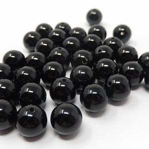 Thirty four black glass beads, diameter 1.1 cm, free shipping