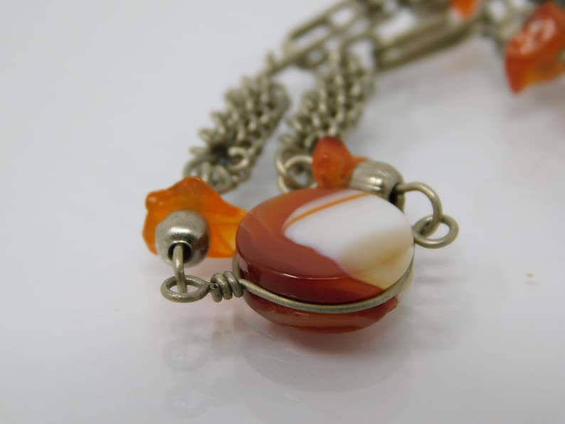 silver metal bracelet with agate sprig