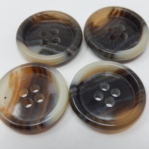 May include: Four brown and white patterned buttons with four holes each.