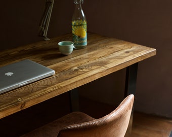 Industrial reclaimed wood desk on black steel legs. Handcrafted, minimal and modern style computer/pc writing desk.