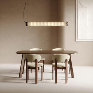 May include: A modern dining room set featuring a dark wood table and four chairs with light green upholstery. A long, cylindrical light fixture hangs above the table. The room has a neutral color palette.