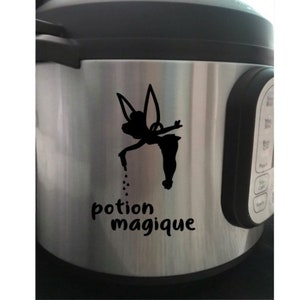 May include: A silver Instant Pot with a black vinyl sticker of Tinkerbell sprinkling fairy dust with the text "potion magique" underneath.
