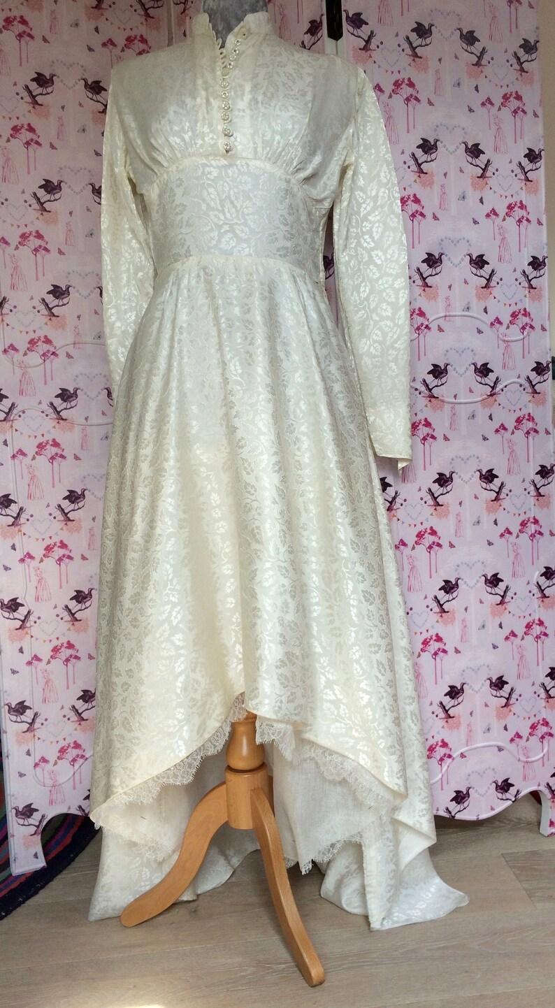 Vintage wedding dress 1950s glowing ivory damask satin with high neckline long sleeves and Hi-Lo hem. Dainty little collar & floral buttons. image 2