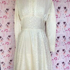 Vintage wedding dress 1950s glowing ivory damask satin with high neckline long sleeves and Hi-Lo hem. Dainty little collar & floral buttons. image 6