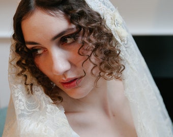 Antique Juliet cap wedding veil made from 1900s Victorian blonde silk lace / deep ivory or cream tulle, with added beading around the face.