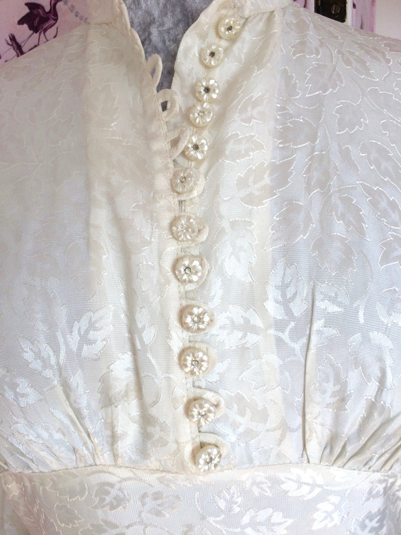 Vintage wedding dress 1950s glowing ivory damask satin with high neckline long sleeves and Hi-Lo hem. Dainty little collar & floral buttons. image 1