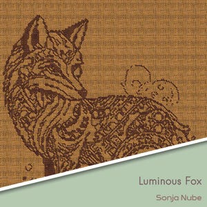 May include: A brown and tan cross-stitch design of a fox with intricate patterns. The fox is looking to the right, with the text "Luminous Fox" and "Sonja Nube" in the lower right corner. The background is a textured tan.