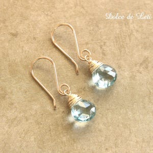 Aquamarine artisan gold dangle earrings. March birthstone. Handmade by Dolce de Leti.