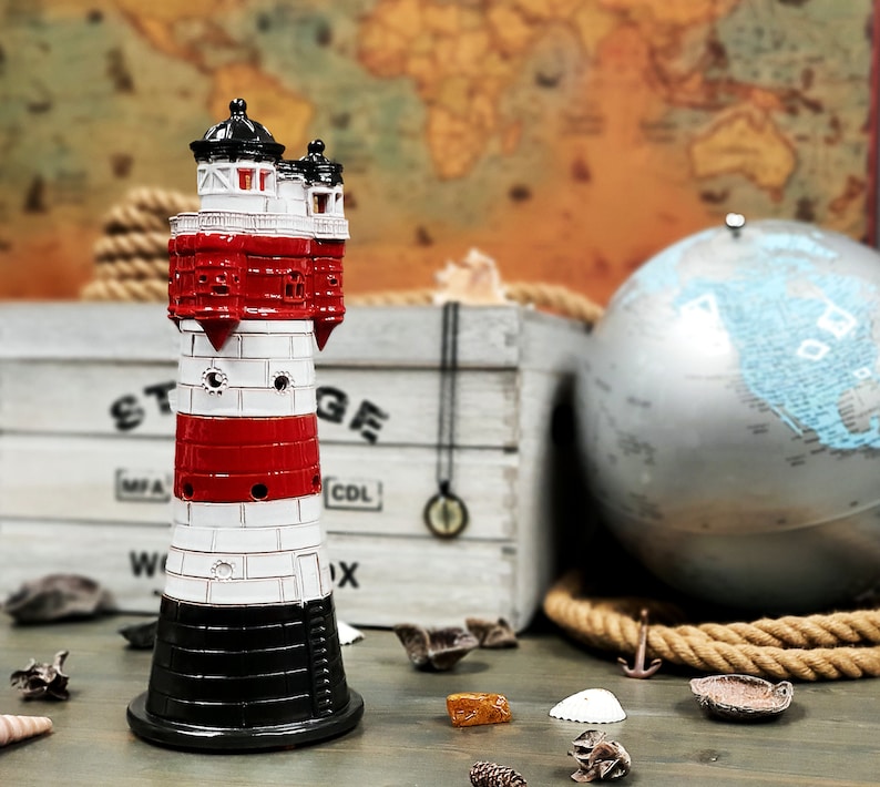 Handmade ceramic lighthouse candle holder are made as the model of the Roter Sand lighthouse, Germany.