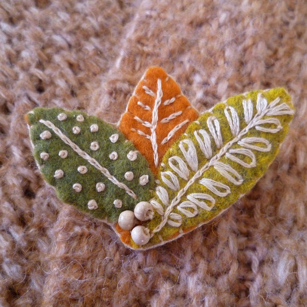 Leaf brooch embroidered by hand in green and orange natural wool felt