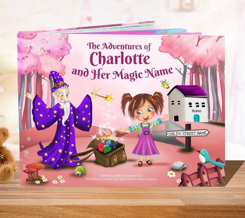 May include: A pink and purple illustrated children's book cover with the title "The Adventures of Charlotte and Her Magic Name". The cover features a girl with pigtails, a wizard, and a house with the word "Home" on it.
