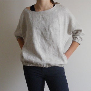 Oversize linen blouse with  pockets and 3/4-length sleeves.