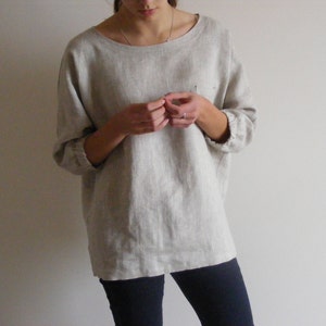 Oversize linen top with chest pocket and 3/4-length sleeves.
