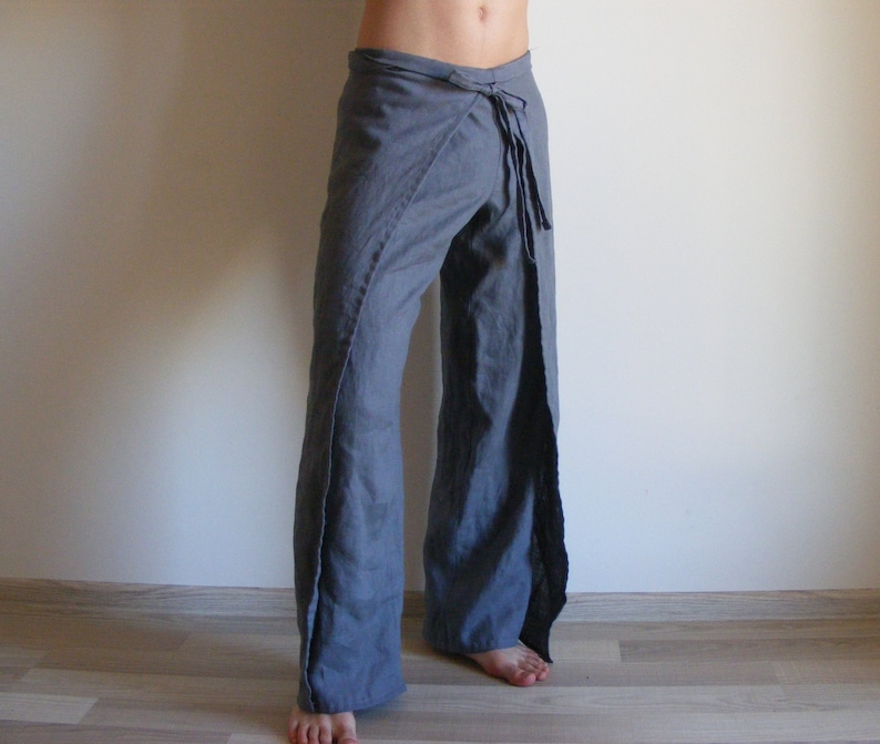 May include: Gray wrap pants with a tie at the waist.