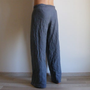 May include: Gray linen pants with a wide leg and a tie waist.