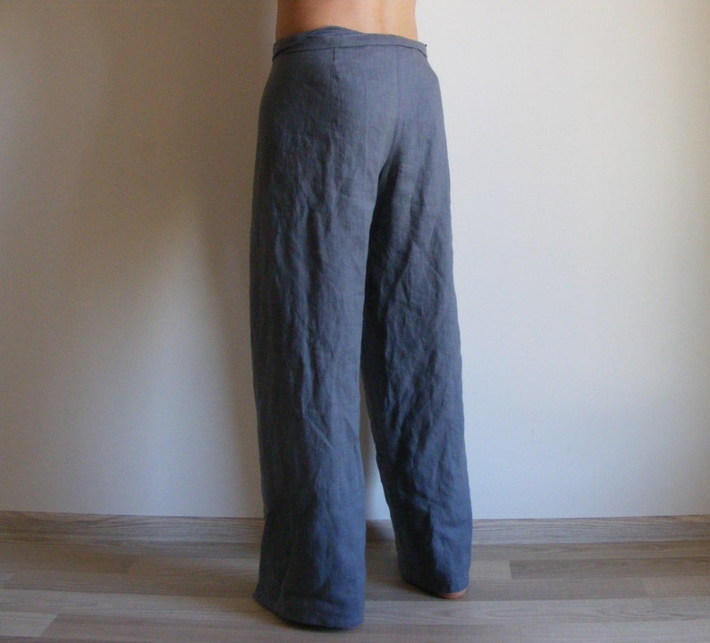 May include: Gray linen pants with a wide leg and a tie waist.