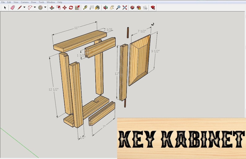 May include: Diagram of a wooden key cabinet with dimensions labeled in inches. The cabinet is made of four vertical pieces, two horizontal pieces, and a door. The door is 9 1/2 inches tall and 7 1/2 inches wide. The cabinet is 12 1/2 inches tall and 11 inches wide. The text "KEY KABINET" is printed on a wooden sign.