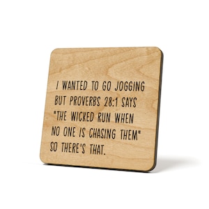 May include: A wooden sign with the text "I wanted to go jogging but Proverbs 28:1 says "The wicked run when no one is chasing them" so there's that."