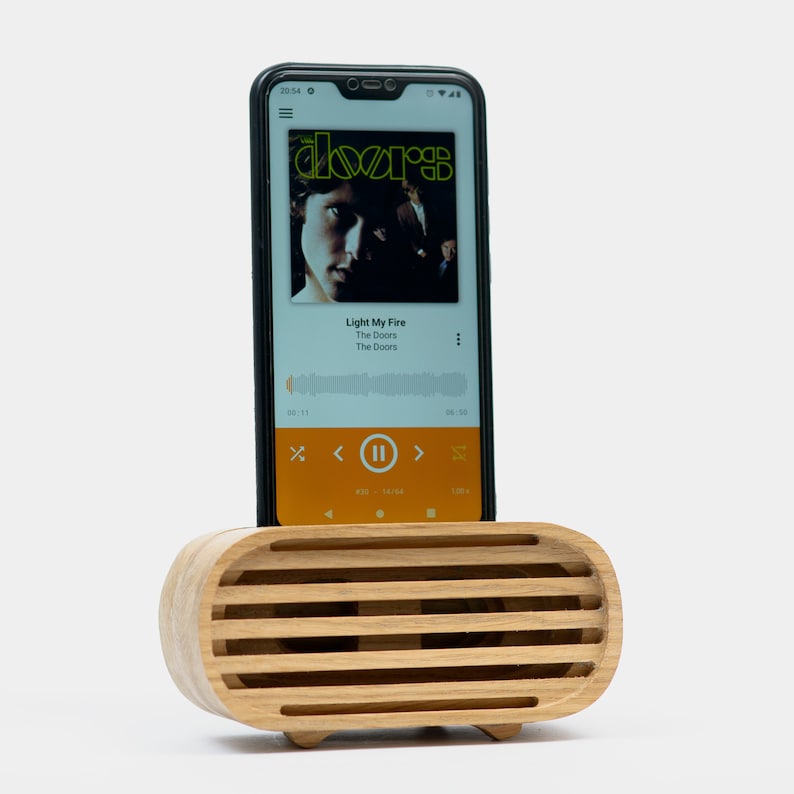 Natural color untoned (yellow) wood phone speaker with phone within