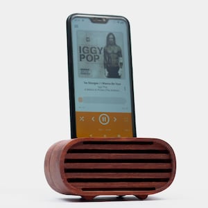 Red wood phone speaker with phone installed