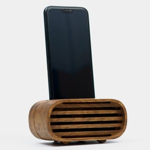 Brown toned wood phone stand with phone inserted
