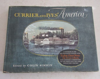 May include: A green book cover with the title "Currier and Ives' America" in gold lettering. The cover features an illustration of a steamboat on a river with trees and a cloudy sky. The text "Eighty Choice Prints in Full Color" is also on the cover.