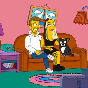 May include: A digital cartoon illustration featuring two yellow-skinned characters sitting on a brown sofa with a small black and white dog. The character on the left wears a white hoodie and blue jeans, while the character on the right wears a black top and skirt with leg tattoos. The text GraffyCartoon is visible on the television.
