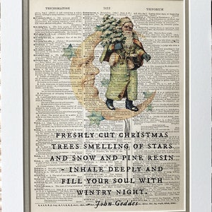 May include: A vintage Christmas illustration featuring a bearded man in a red coat and hat, holding a bag of gifts and a horn, standing on a crescent moon. The illustration is surrounded by text from a dictionary page, including the words "FRESHLY CUT CHRISTMAS TREES SMELLING OF STARS AND SNOW AND PINE RESIN INHALE DEEPLY AND FILL YOUR SOUL WITH WINTRY NIGHT." The text at the bottom of the image reads "John Goddes."