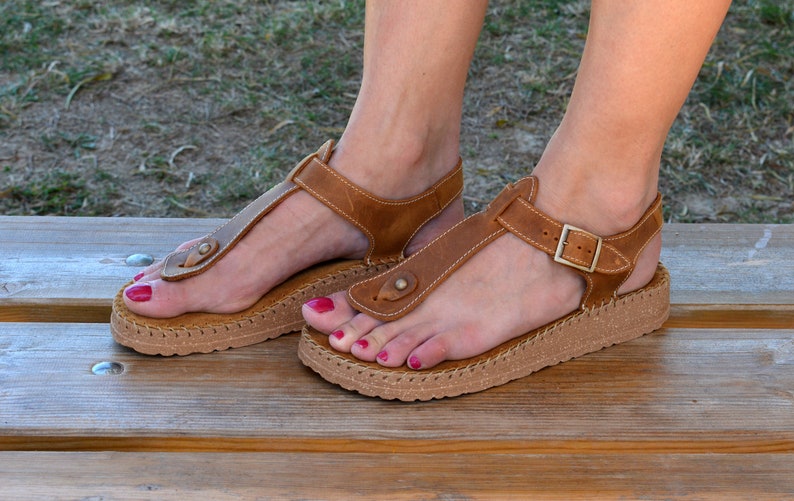 tan sandals with white sole