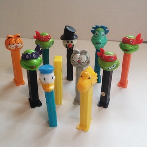Vintage Donald Duck Teenage Mutant Ninja Turtles Garfield Holidays Pez Dispensers Set of 11