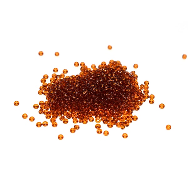 50, 70 ou 100 g  Rocailles 11/0 topaz transparent (brun / orange) transparent A39 (petites perles rondes)