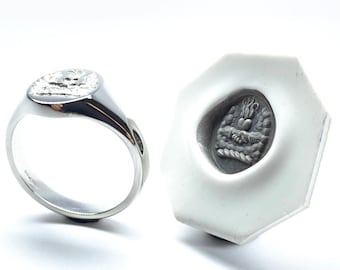 Platinum oval signet ring deep seal engraved by hand and complete with wax impression