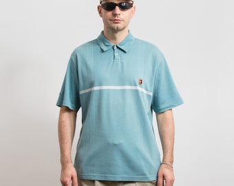 Nike poloshirt vintage | Lichtblauw geborduurd logo uit de jaren 90 | herenmaat L