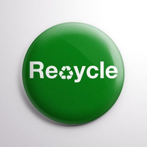 May include: A green round button with the word "Recycle" in white text and a white recycling symbol.