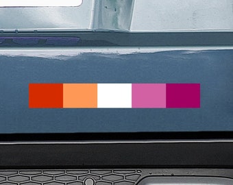 May include: A car with a lesbian pride flag sticker on the back bumper. The sticker is a horizontal stripe of red, orange, white, pink, and purple.