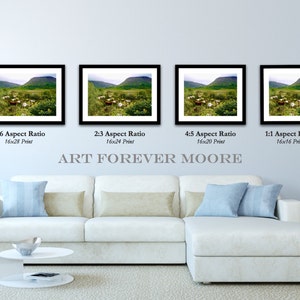 May include: Four framed landscape prints with black frames are displayed above a white sectional sofa. The prints vary in aspect ratio and size, with the largest being 16x28 inches. The text "ART FOREVER MOORE" is below the prints.