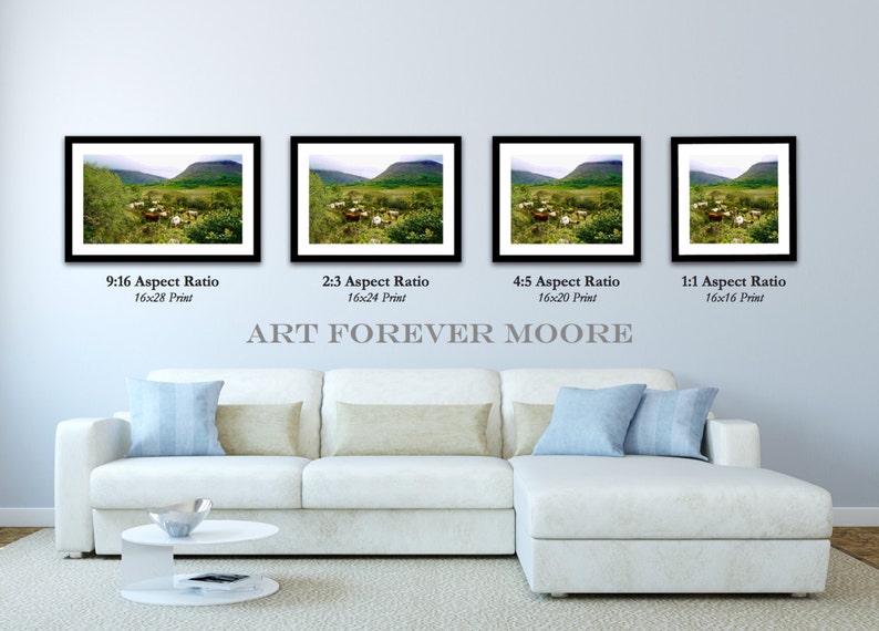May include: Four framed landscape prints with black frames are displayed above a white sectional sofa. The prints vary in aspect ratio and size, with the largest being 16x28 inches. The text "ART FOREVER MOORE" is below the prints.