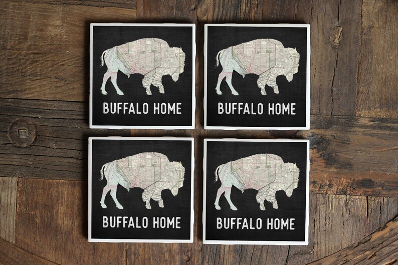 May include: Set of four black and white coasters with a map of Buffalo, New York, inside the silhouette of a buffalo. Each coaster has the text "Buffalo Home" printed on it.