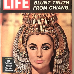 May include: A vintage October 6, 1961, LIFE magazine cover featuring Elizabeth Taylor as Cleopatra. The headline reads BLUNT TRUTH FROM CHIANG and AS CHINA FIGHT GETS HOT A FACE-TO-FACE TALK. A smaller box reads EXCLUSIVE LIZ TAYLOR Back at Work As Cleopatra.