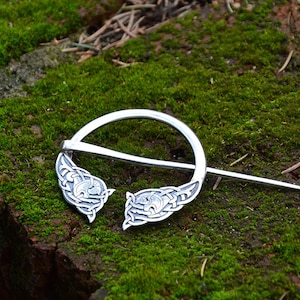 Kelpie silver brooch – penannular animal style cloak pin with Celtic knots, inspired by Scottish medieval art, folklore, and misty lakes