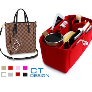 May include: A red felt bag organizer with multiple compartments for a purse. The organizer is filled with items such as a phone, a wallet, a water bottle, and other accessories.  The organizer is designed to fit inside a brown and black checkered tote bag with a black strap.