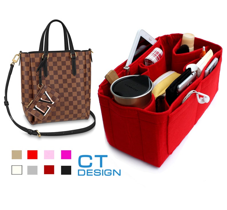 May include: A red felt bag organizer with multiple compartments for a purse. The organizer is filled with items such as a phone, a wallet, a water bottle, and other accessories.  The organizer is designed to fit inside a brown and black checkered tote bag with a black strap.