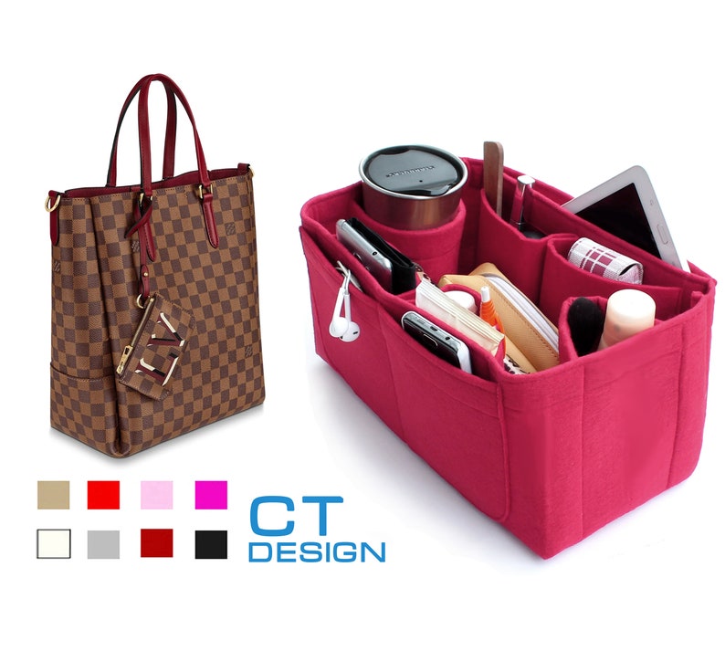 May include: A pink felt handbag organizer with multiple compartments for carrying items like a phone, wallet, and makeup. The organizer is shown inside a brown and tan checkered handbag.
