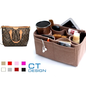 May include: A brown and tan patterned handbag with a beige felt organizer insert. The organizer has multiple pockets and compartments for carrying various items, such as a phone, wallet, and keys.