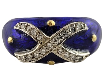 May include: A blue enamel ring with a gold and diamond X design.