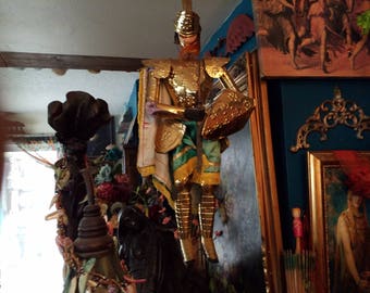 A good knight....gold tone articulated puppet, with shield and sword