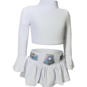 Star Wars-inspired toddler swimsuit set with shiny galactic belt and long sleeves for sun-safe swimwear and imaginative play

Space princess costume swim set with crop rash guard top and skirted bottom featuring iridescent belt detail for girls

Galactic girl swim outfit with long sleeves and futuristic belt, perfect for sci-fi beach parties, pool days, or costume fun